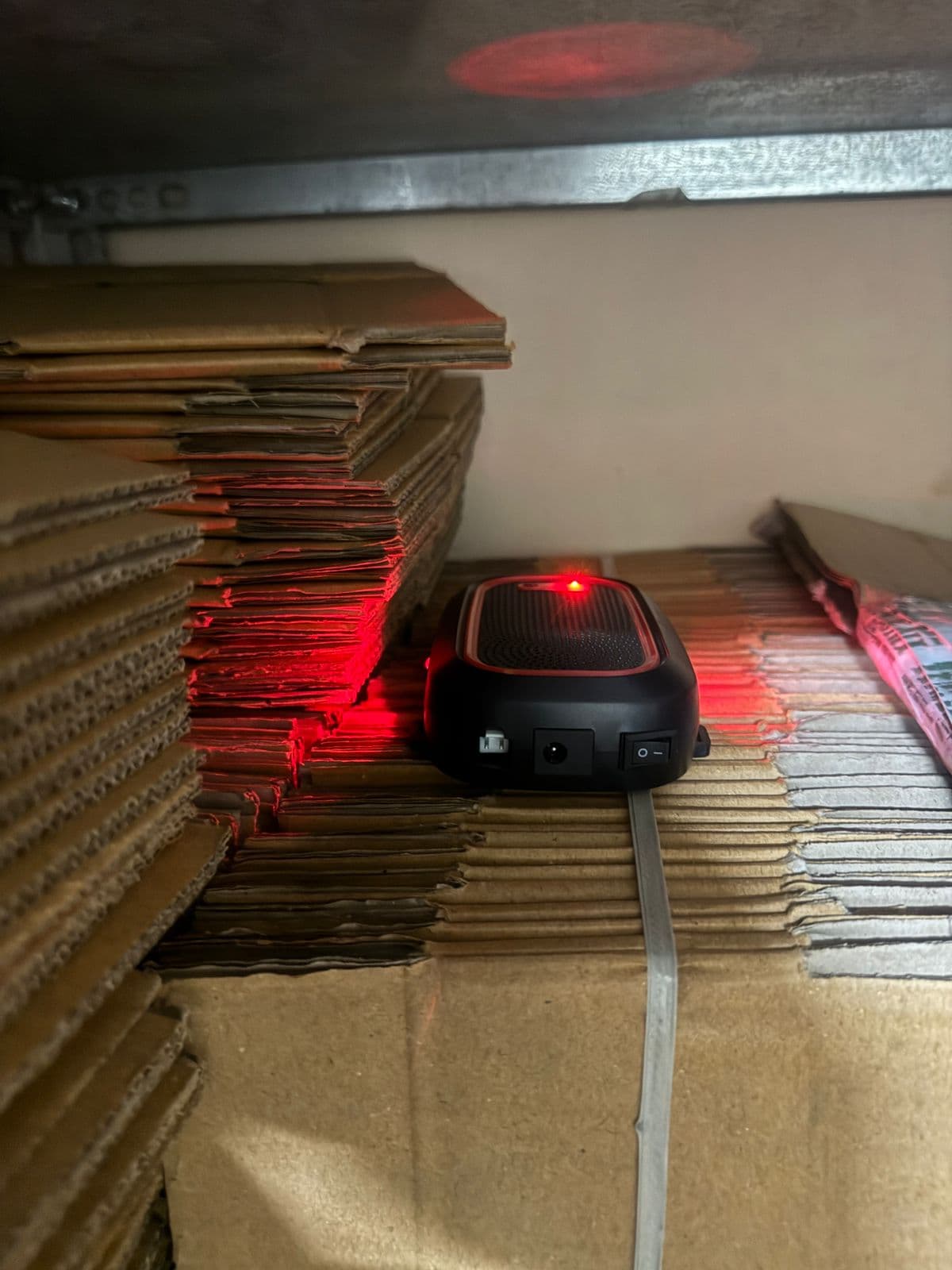 Suresh's Echo Repel operating beside cartons in his storage room